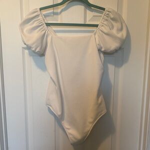 Show Me Your Mumu Pink Label on Cream Garment